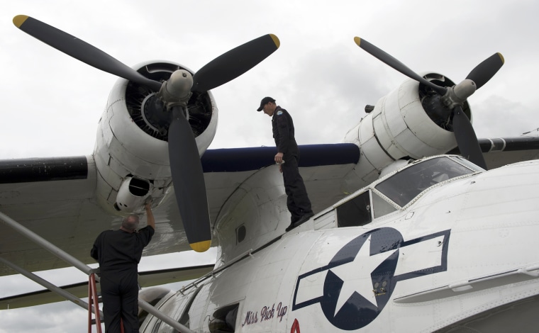Image: Aircrew clean a Catalina flying boat at